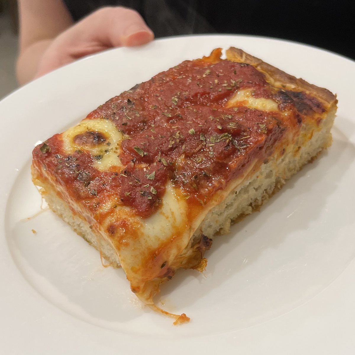 montch's tweet photo. We get some pretty fantastic pizza down in Melbourne, but there’s one thing that's quite hard to find here: NYC-style square pan pizza.

So after getting way too hungry watching videos of Sicilian pan pizza from the US, I decided to have a go at making one myself.

I was absolutely shocked at how well it turned out for something so simple to make. Incredible flavours, despite using just a few basic ingredients and a regular oven. No fancy pizza stone required either.

I found two things made a big difference to the flavour:
1. Giving the dough a 24h cold rise in the fridge. Definitely worth the patience.
2. Gently frying the dried oregano with the sliced garlic, rather than adding it to the sauce after the tomato goes in.

Maybe the dough could have been less dense, but I honestly don't care: it tasted incredible.😂

100% worth a repeat!👌