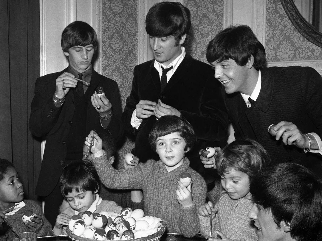 BeatlesArchive2's tweet image. The #Beatles with orphans from the Church of England Children’s Society, decorating Easter eggs, March 1964
