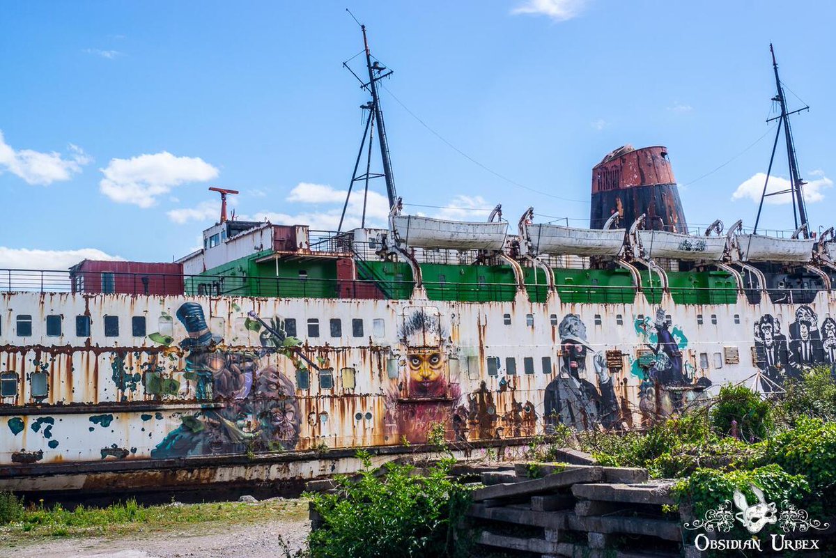 ObsidianUrbex's tweet image. 🚢 All aboard the Fun Ship! TSS Duke of Lancaster, moored near Mostyn Docks in North Wales. Installed in 1979 as the "Fun Ship" to dodge Sunday trading laws. Closed in 2004. Graffiti murals in 2012; repainted black in 2017. #NorthWales #Graffiti #UrbanArt