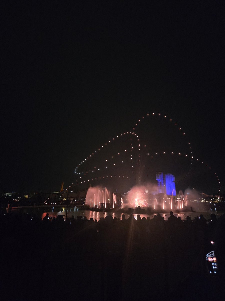 DLPGuestEN's tweet image. Cascade of Lights with Tales of Magic in the background.