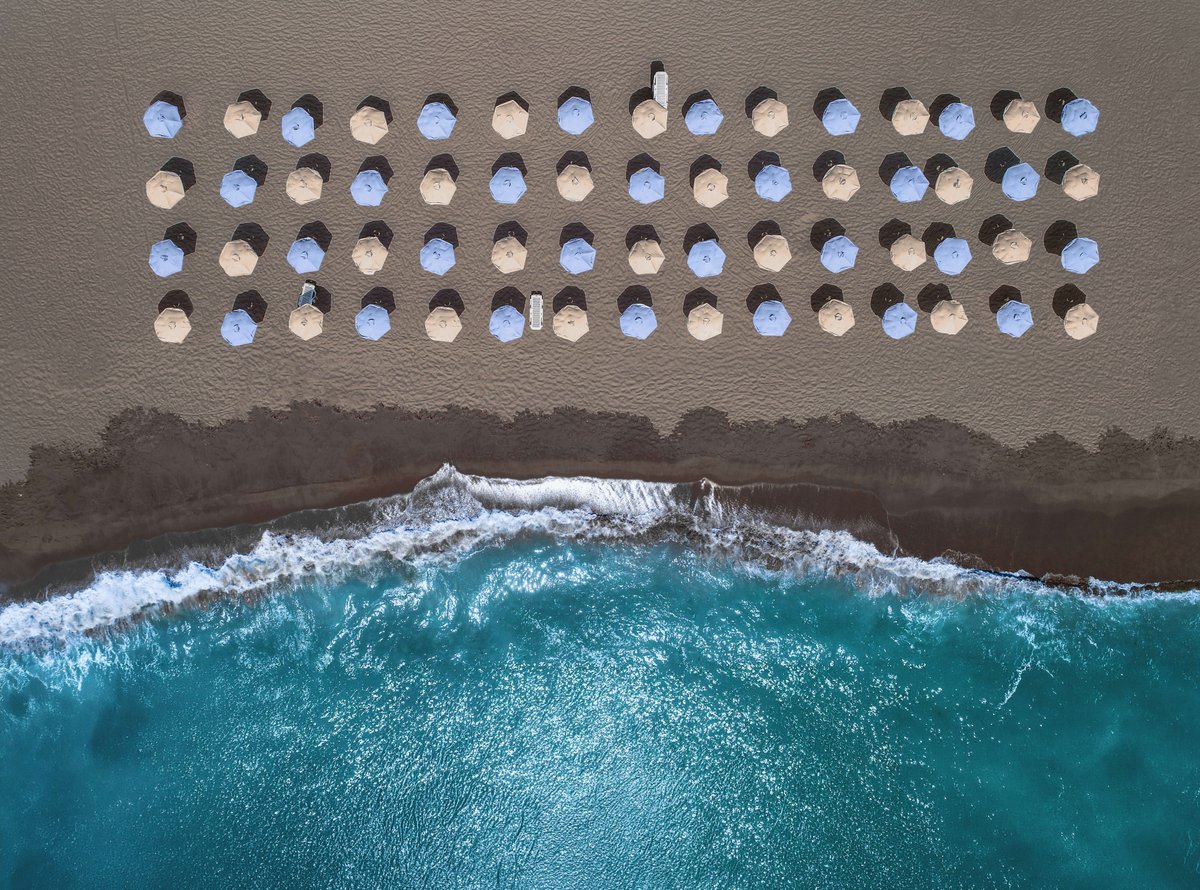 Plush towels, shaded loungers, and breathtaking views from a secluded black‑sand beach… this is relaxation redefined at Royal Beach Club Santorini 🌅💙

Make this your next getaway — message me at gatherstravel@live.com today to start planning!