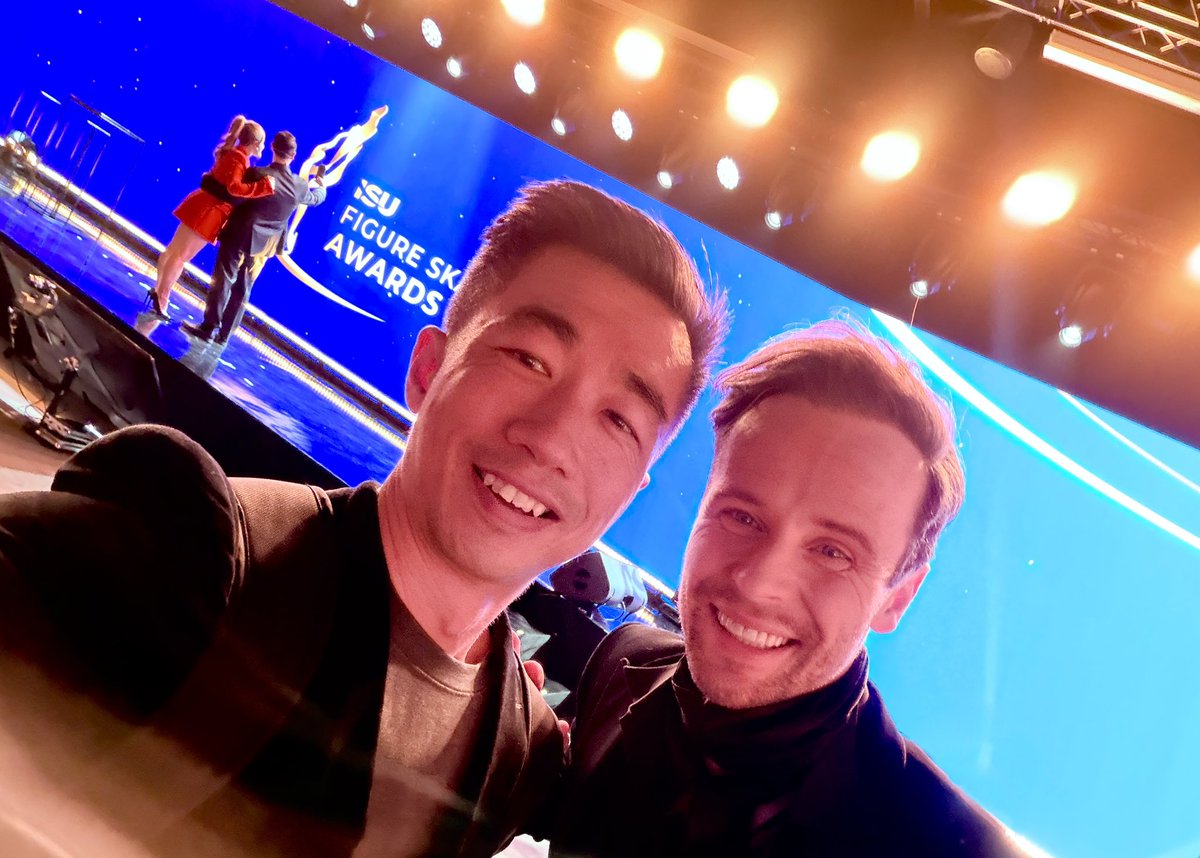 Too many things happening in this photo with <a href="/Mark_Hanretty/">Mark Hanretty</a> - the backlit, the random lens flare, the fact that <a href="/AshWagner2010/">Ashley Wagner</a> and <a href="/Ben_Agosto/">Ben Agosto</a> are doing their own selfie behind us