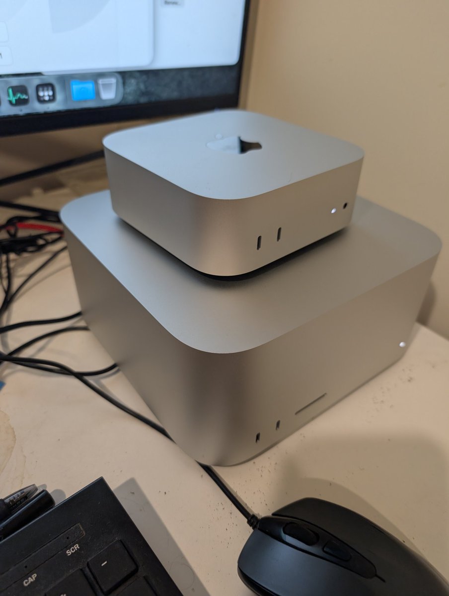 _nathanknapp's tweet photo. It's not much, just two Macs on a desk running local AI 24/7. No cloud, no API $$$. #Applesilicon 

M4 Mini orchestrates the pipeline, M1 Max Studio handles vision inference. Who else is running local setups at home? Would love to see your rigs.

#localLLM #ollama #homelab https://t.co/YImWPcx7J0