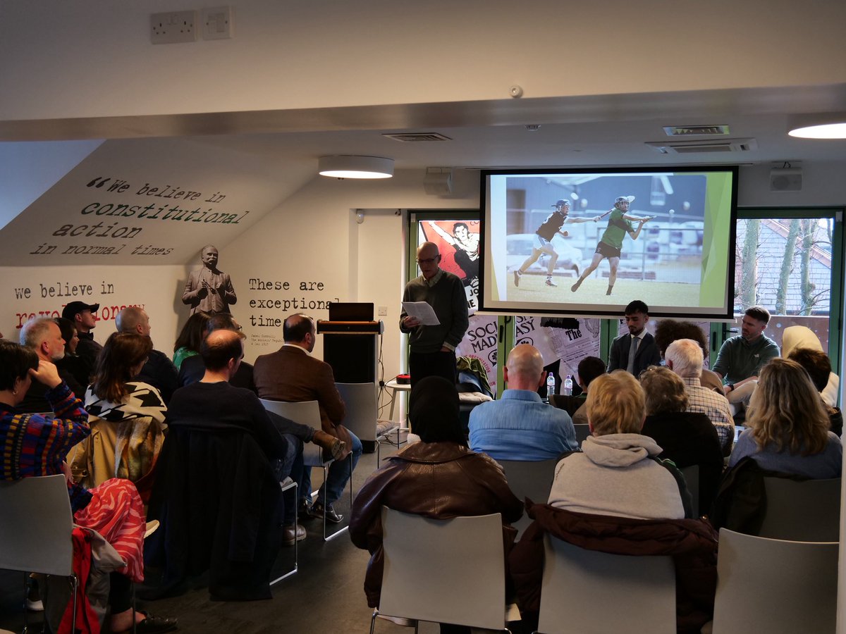 JamesConnollyVC's tweet photo. Wonderful crowd in Áras Uí Chonghaile this afternoon for our event, ‘Almost Like Belonging’ with author Rus Bradburd, 20-year-old Syrian war survivor Ahmed Soda, and his GAA coach Ciarán Doherty. 

Discussing how refugee children are assimilating in Belfast through the GAA. https://t.co/dmrsmOlU93