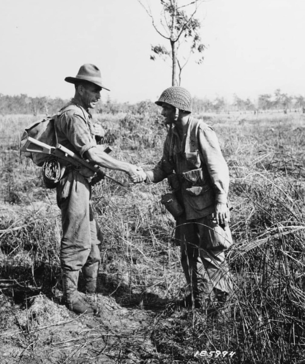 Jason_R_Burt's tweet photo. A paratrooper of the 503rd PIR shakes hands with an Australian “Digger” after their successful capture of Nadzab Airfield on New Guinea. 🇺🇸🇦🇺 https://t.co/GwWTgYacQK