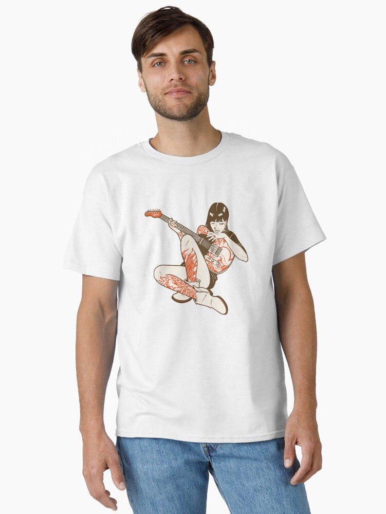 ExcesssShop's tweet photo. Get my art printed on awesome products. Support me at Redbubble #RBandME:  https://t.co/OKe6g32KGU #findyourthing #redbubble 

Bold vintage-style illustration of a rock and roll girl sitting cross-legged playing an electric guitar. Features a striking limited color palette of brown, cream, and orange-red with detailed tattoo-style graphics including flames, comic book lettering, and punk motifs on her clothing. Retro screen-print aesthetic perfect for band merch, music posters, t-shirt designs, stickers, album art, and rock-themed apparel and merchandise.