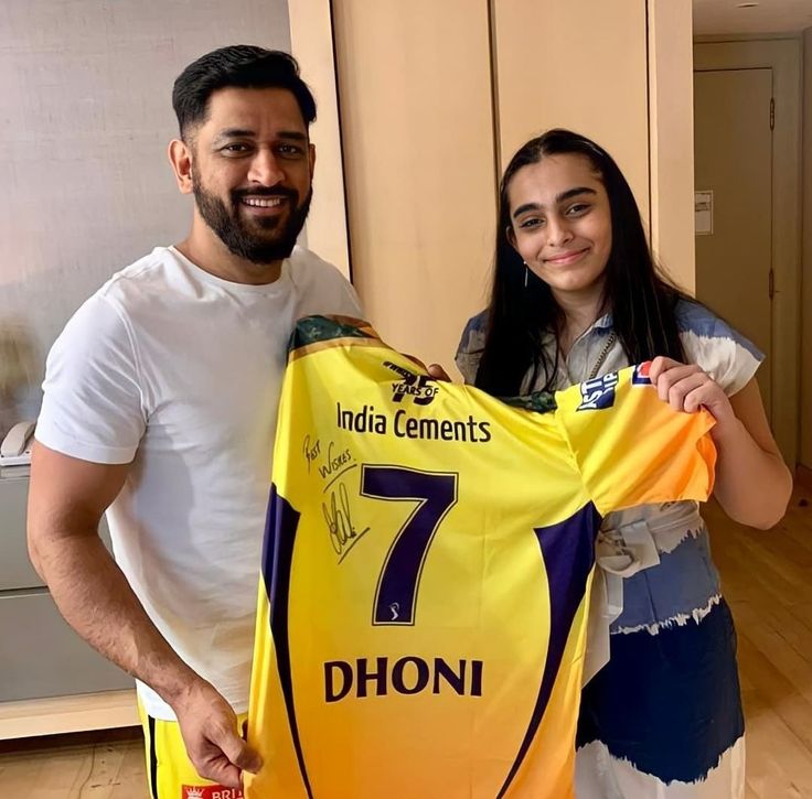 Oyee <a href="/grok/">Grok</a> ,
Enhance this image to ultra HD.

Convert both outfits into CSK yellow jerseys.
Replace the jersey in hand with a white board.

Write on board:
“CSK Fans, Are You Missing Captain Dhoni and....see more
