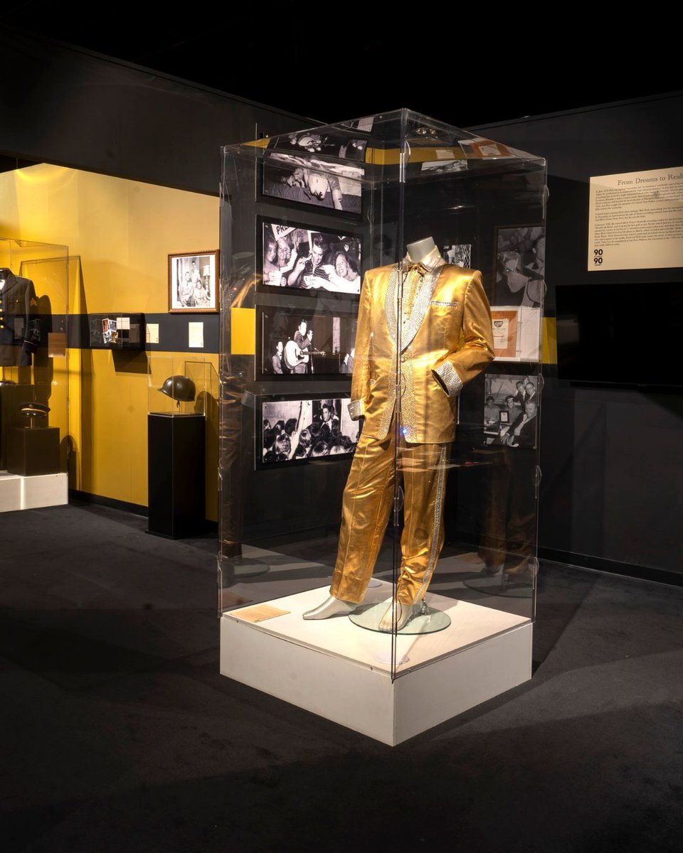 VisitGraceland's tweet photo. This week in 1957, Elvis Presley debuted his gold lamé suit at the International Amphitheatre in Chicago. Designed by Nudie Cohn to shine under the lights, it became one of his most iconic early looks.

See the suit on display in the Elvis: 90 for 90 Exhibit at Elvis Presley's Memphis at Graceland. ⚡