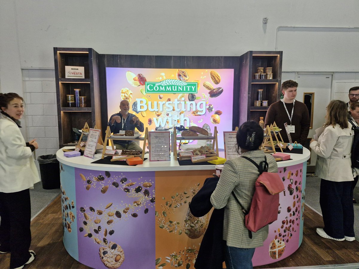 Symbiosis_UK's tweet photo. Live from @IFE_Event 2026! The @community_foods stand is bringing a splash of colour to @ExceLLondon - designed &amp; built by Team Symbiosis. One of three stands we’ve delivered at this year’s show.
#exhibitiondesign #standdesign #communityfoods https://t.co/FmdLRYZqAi