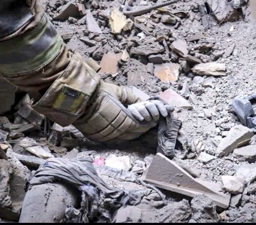 A child buried under the rubble in Iran.

America and Israel don’t ‘liberate.’ They kill children,flatten cities, and crush everything you’ve built.