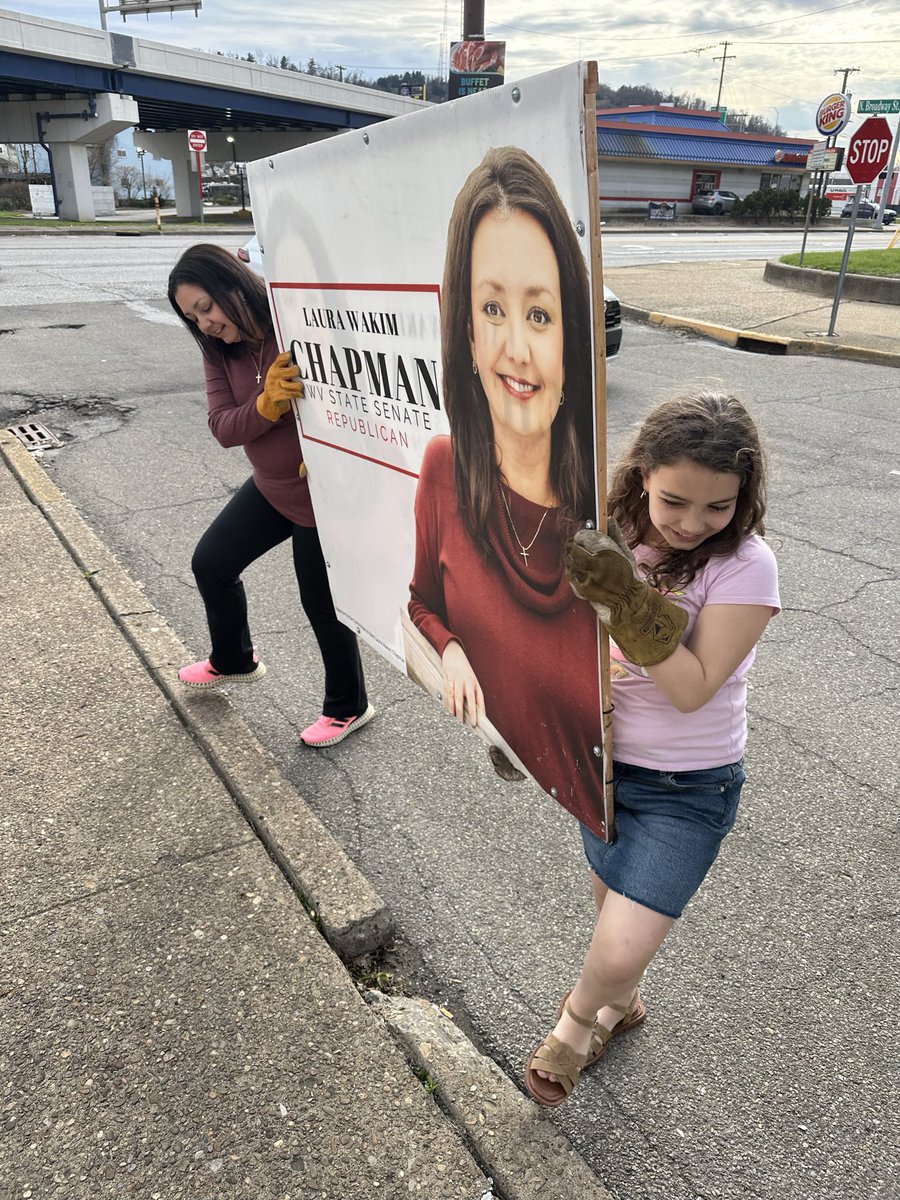 After finding the perfect First Communion dress for her special day, my other favorite adorable helper assisted in sign placements!
