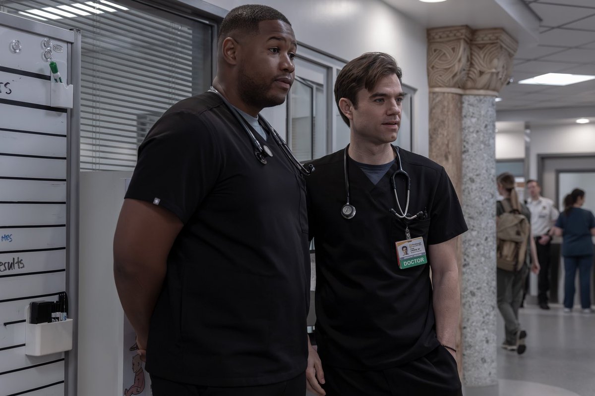 PatCrave's tweet photo. Patrick Ball and Luke Tennie as Dr. Frank Langdon and Dr. Crus Henderson in new still of Season 2: Episode 13 “7:00 PM” of #ThePitt https://t.co/7kJUuudvHy