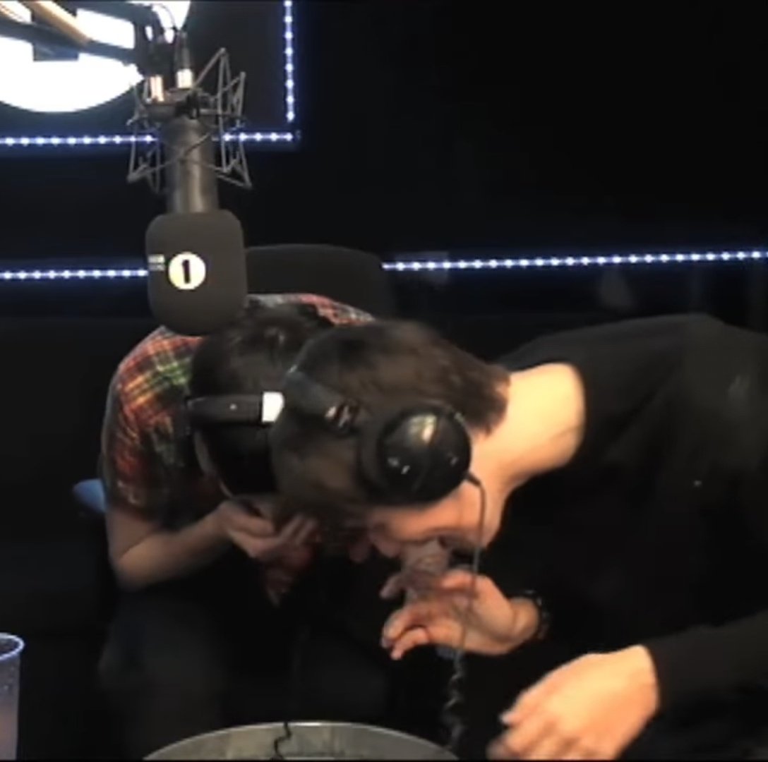 Real footage of Dan and Phil trying not to laugh at their couple massage