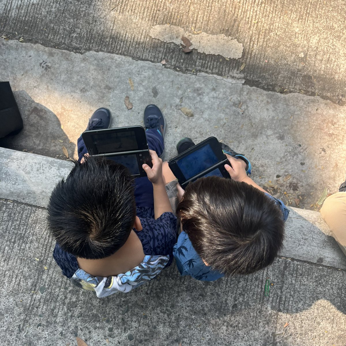 My son bonding with another kid with a Nintendo 3DS before the University of the Philippines Integrated School (UPIS) Kindergarten Admission Test.

UPIS, Diliman, Quezon City. Mon, 30 Mar 2026.