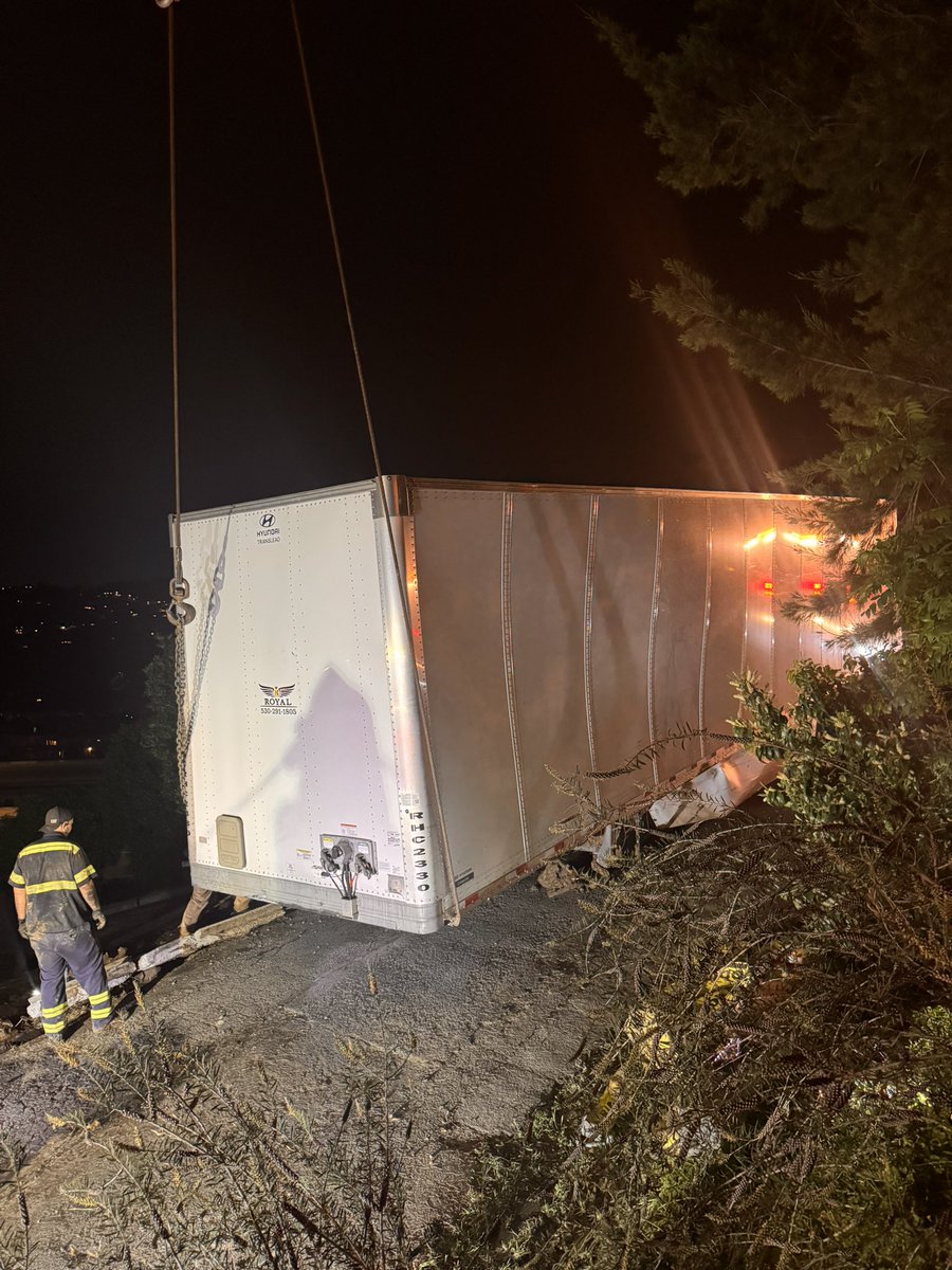Crews have moved the trailer portion of the vehicle onto the street.