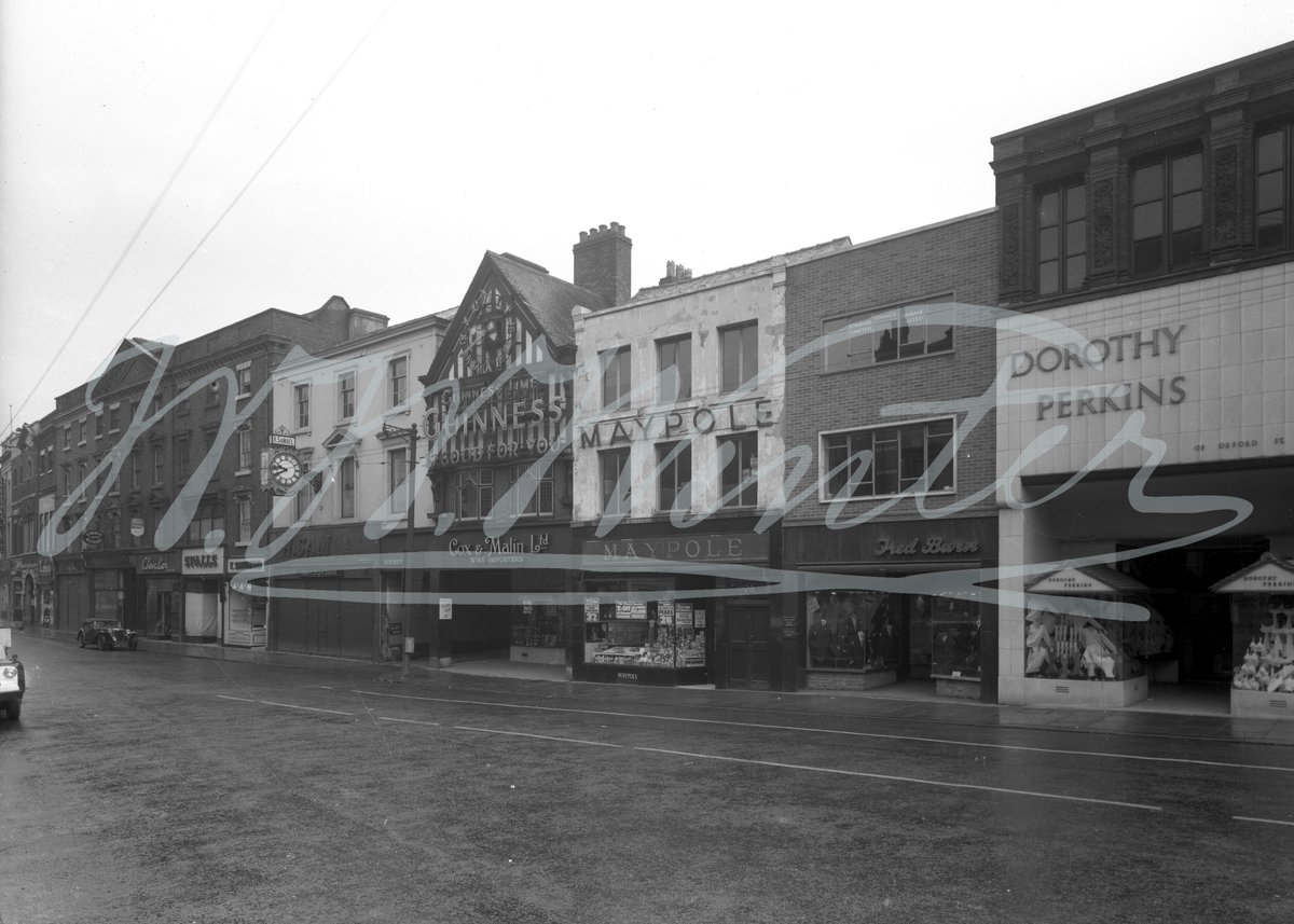 A view of the Cornmarket showing a variety of stores.  The Winter's company (sports) car can be seen parked outside Ramsdens Restaurant.
#Winters1852 #WWWinterHeritageTrust #WWWinterLtd #ShopFront
