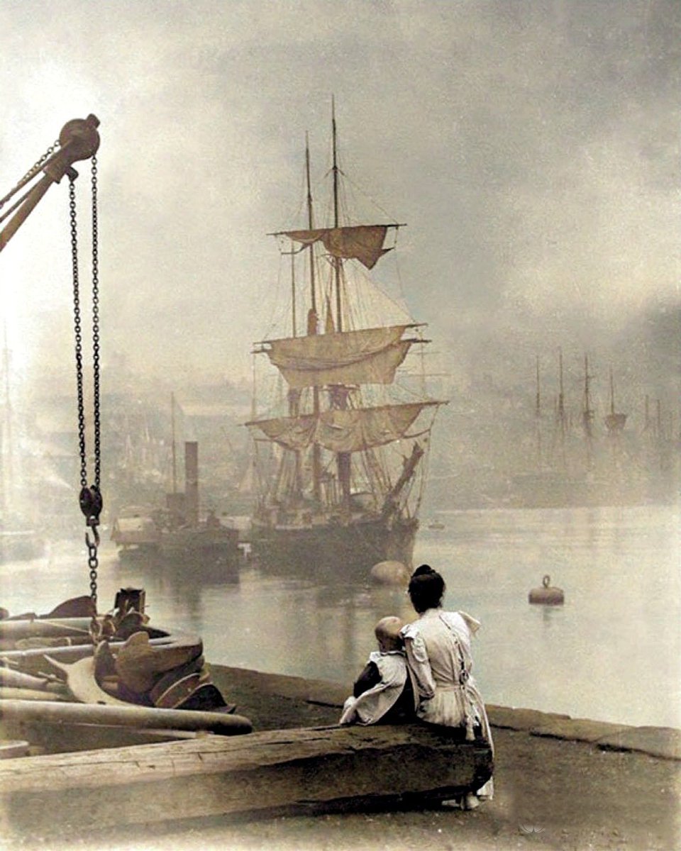 A mother and daughter watch a tall ship navigate the Thames in London, 1880.