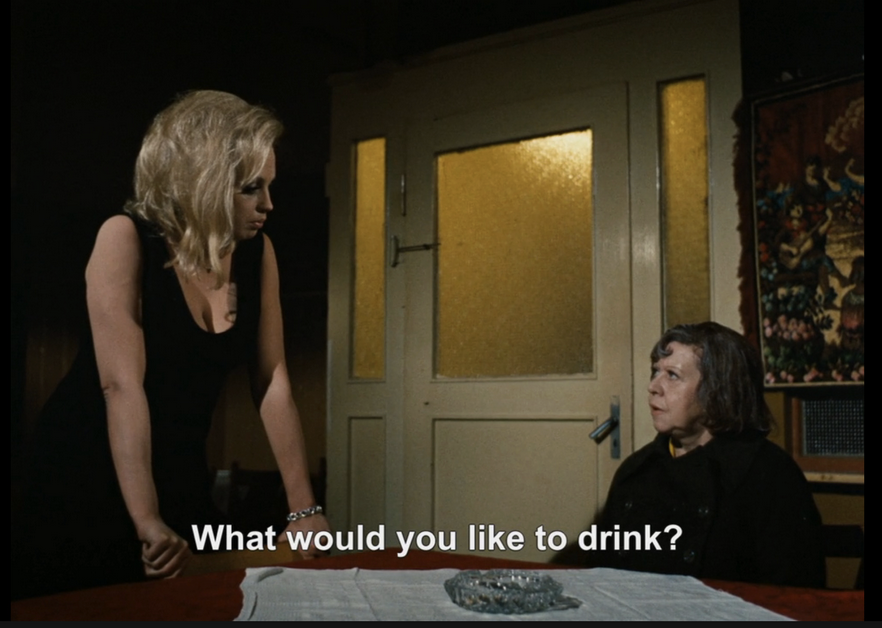 kukukadoo's tweet photo. like many, i was puzzled by dakota johnson's drink order in the opening scene of materialists (2025). but now i realize it's a sophisticated allusion to the opening scene of fassbinder's ali: fear eats the soul (1974) https://t.co/BqYpCSuYRP