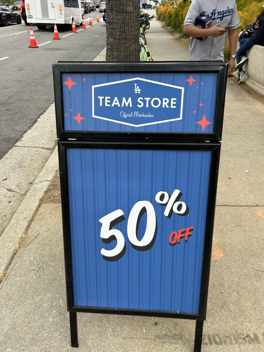 BRAAAVOX's tweet image. First time seeing these trucks. 50% of many  #dodger store items. Located on Vin Scully Ave.