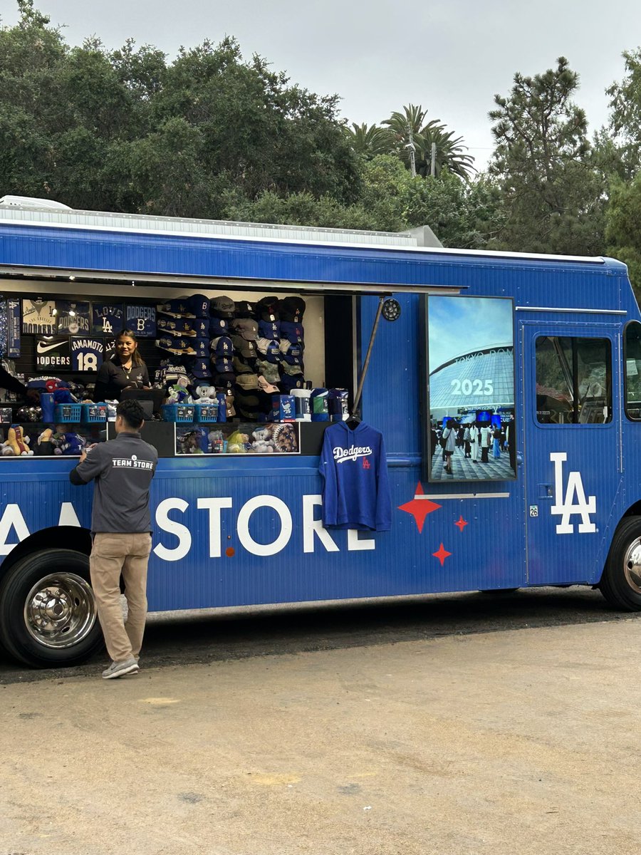 BRAAAVOX's tweet image. First time seeing these trucks. 50% of many  #dodger store items. Located on Vin Scully Ave.