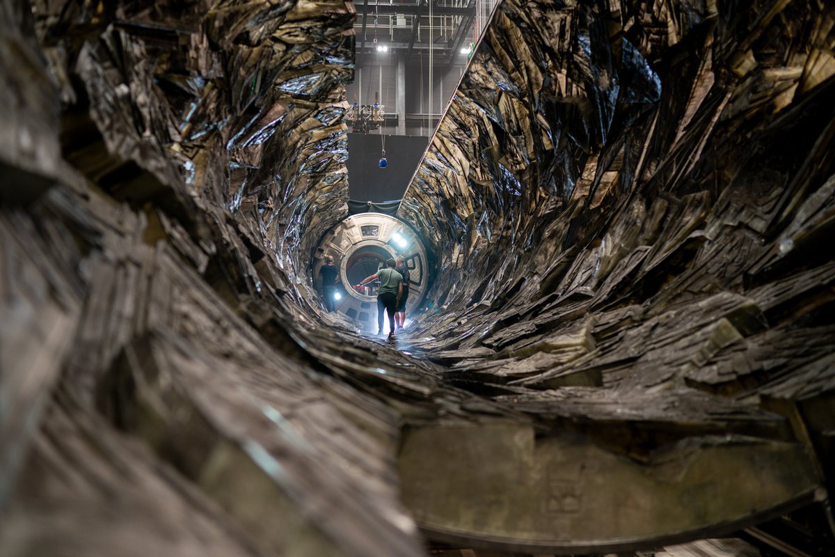 Variety's tweet photo. Cinematographer Greig Fraser breaks down the lighting in “Project Hail Mary,” the most challenging film of his career: 

• The 70-foot tunnel where Rocky meets Grace was illuminated at once rather than using a single moving light to simulate sunlight passing through the entire space. 

• Fraser couldn’t rely on LEDs, so the team built a massive rig of old-school tungsten lights and pixel-mapped them to create a controllable, moving “sun” inside the tunnel. 

• The eerie look of the sequence was inspired by deep-sea footage, with the tunnel designed to feel like descending into darkness, lit only by a single source.  

• Rocky could only be front-lit and couldn’t emit any light of its own, so everything had to come from the “sun” source in the scene. 

https://t.co/WmovcR9dj7