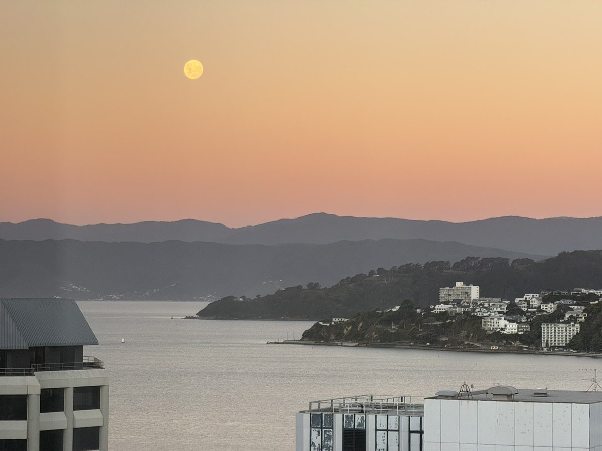 Moonrise over the harbour (through a dirty hotel window)