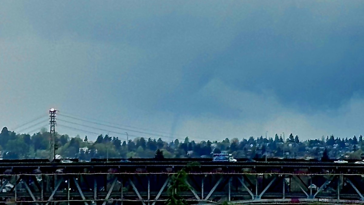 The_Weatherman2's tweet image. Enhanced WATERSPOUT photos! #Seattle waterspout at 3:01 PM on Wednesday! Viewed from the UW Atmospheric Science building roof, looking SW over the Ship Canal Bridge and over part of Queen Anne. Not every day you see a waterspout from school! #wawx #waterspout