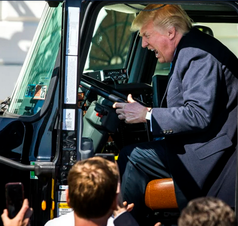 Aww! That's cute. They gave him a fake wheel to play with. The real bridge is behind him. It's like when he sat in the truck, except that was real of course...