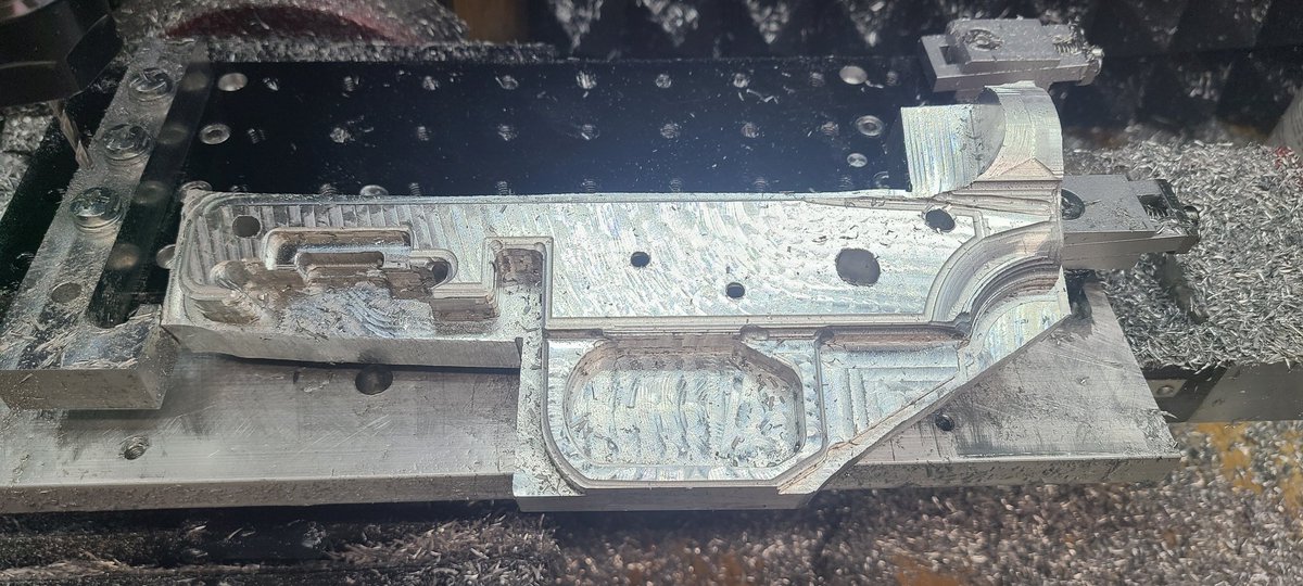 BearmanArms's tweet photo. One side done. The holes are undersized and will be reamed out. I will be trying PLA+ soft jaws to get the other side done.  Not bad for having to move it half way through. https://t.co/TdDawrk4cr