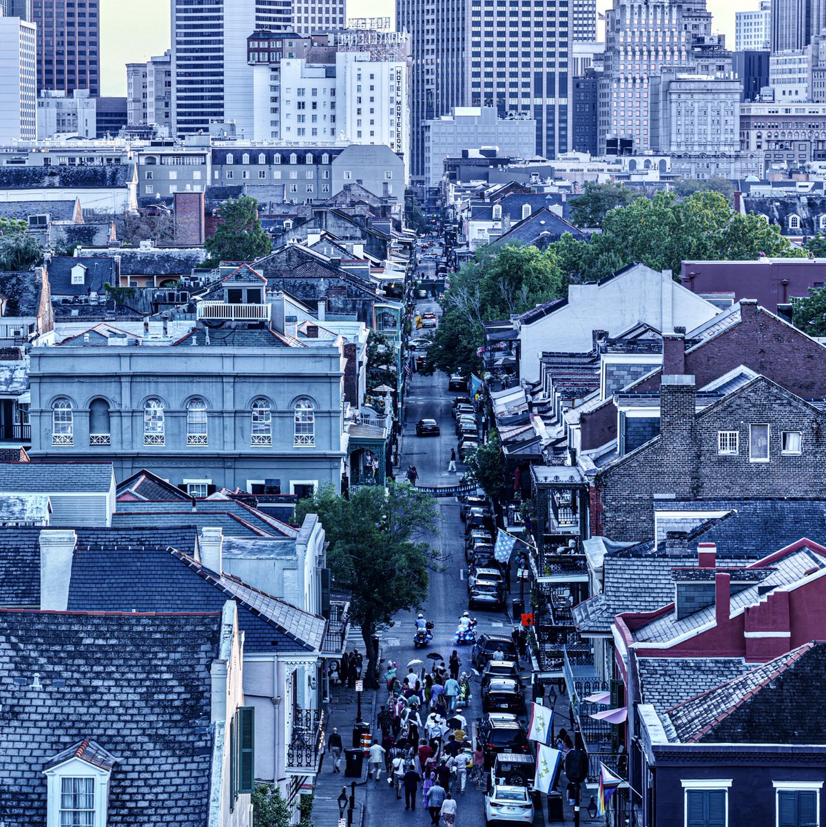 A wedding second line goes up Royal, New Orleans