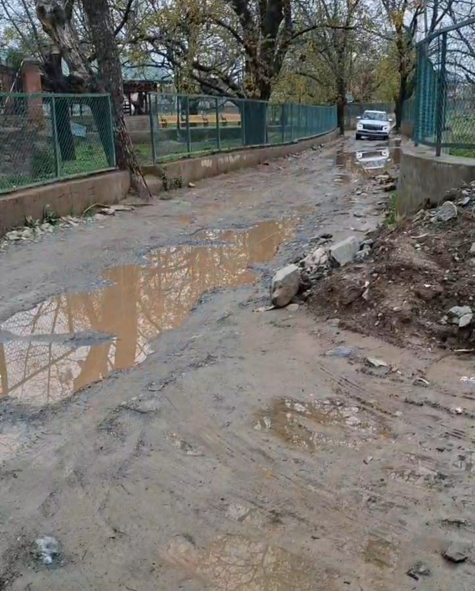 bukhariaadik's tweet photo. Ziyarat Road in Kreeri Lies Incomplete, Residents Face Mounting Hardships

Authorities draw flak for inaction as officials fail to provide a satisfactory response to halted construction

KREERI, BARAMULLA, April 2: Residents of Kreeri and its adjoining areas in north Kashmir have expressed strong resentment over the incomplete construction of the Ziyarat road, accusing the Rural Development Department of neglecting a vital public project and leaving locals to suffer.
        The road, which stretches from Kreeri Market to the revered shrine of Syed Haji Mohammad Murad Bukhari (RA), serves as a crucial link for more than 20 villages, connecting Kreeri to Babareshi and Tangmarg via areas such as Suchipora, Dolipora, Kawachak Sheikhpora, Khaipora Kakothal, Nambalnar and others. Locals say the road is currently in a dilapidated condition, riddled with potholes and posing serious risks to commuters.
Residents alleged that despite repeated appeals, the department has failed to address the worsening condition. “The authorities seem to be in deep slumber. The road is in a shabby state, and vehicles are getting damaged regularly. Children and elderly people are finding it difficult even to walk,” they said.
They stated that the road had previously suffered from severe waterlogging due to poor drainage. Following persistent demands, funds were eventually sanctioned and construction work, including the laying of drainage pipes, was initiated. However, the work was abruptly halted just before the holy month of Ramadan and has not resumed since.
As a result, the situation has deteriorated further, with water accumulating on the road, soil subsiding at multiple locations, and the entire stretch turning muddy and unsafe for both pedestrians and vehicles. Residents said the incomplete work has created serious inconvenience, particularly for patients, school-going children and emergency services.
The issue has gained urgency with the approaching Urs of Syed Haji Murad Bukhari (RA), an annual religious event that draws a large number of devotees from across the region. Locals fear that the current condition of the road may lead to severe inconvenience, traffic disruptions and potential safety hazards for visitors.
Adding to the concerns, residents claimed that the contractor had cited alleged threats from certain individuals as a reason for not resuming the work, raising questions over the smooth execution of public welfare projects in the area.
Meanwhile, residents of the Kreeri-Wagoora constituency have appealed to their MLA, Advocate Irfan Hafiz Lone, to intervene and ensure immediate resumption of the work. “We only see politicians during elections. Basic amenities like road connectivity remain neglected,” they said, urging the MLA to visit the area and assess the situation firsthand.
When contacted, Assistant Commissioner Development (ACD) Baramulla, Mudasir Choudhary, stated that he would verify the project's status and respond accordingly. However, no further response was received, and subsequent attempts to reach him went unanswered, further adding to the residents’ frustration @MoRD_GoI @DCBaramulla @OmarAbdullah @nasirsogami @CM_JnK @PMOIndia @narendramodi @rashtrapatibhvn @Irfanhafeezlone @rddkashmir @DivComKash @JavedDar_NC @jkrddpr @mopr_goi @javidahmaddarjk