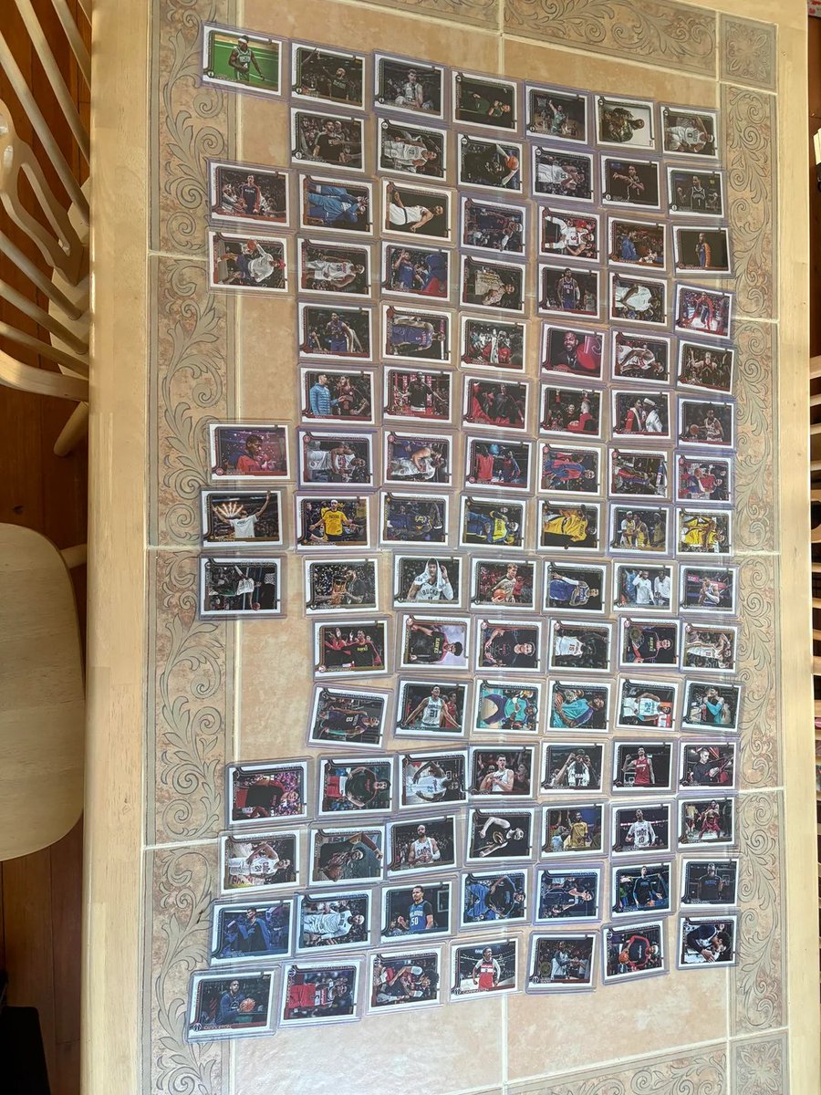 Topps's tweet photo. ACHIEVEMENT UNLOCKED: A collector on Reddit completed the entire 300-card Golden Mirror image variation FULL SET from 2025-26 Topps Basketball 🔥

These are super short printed and can be extremely difficult to track down... A truly epic journey. 👏

(via u/chris_phguy84) https://t.co/OabsjUSrCg