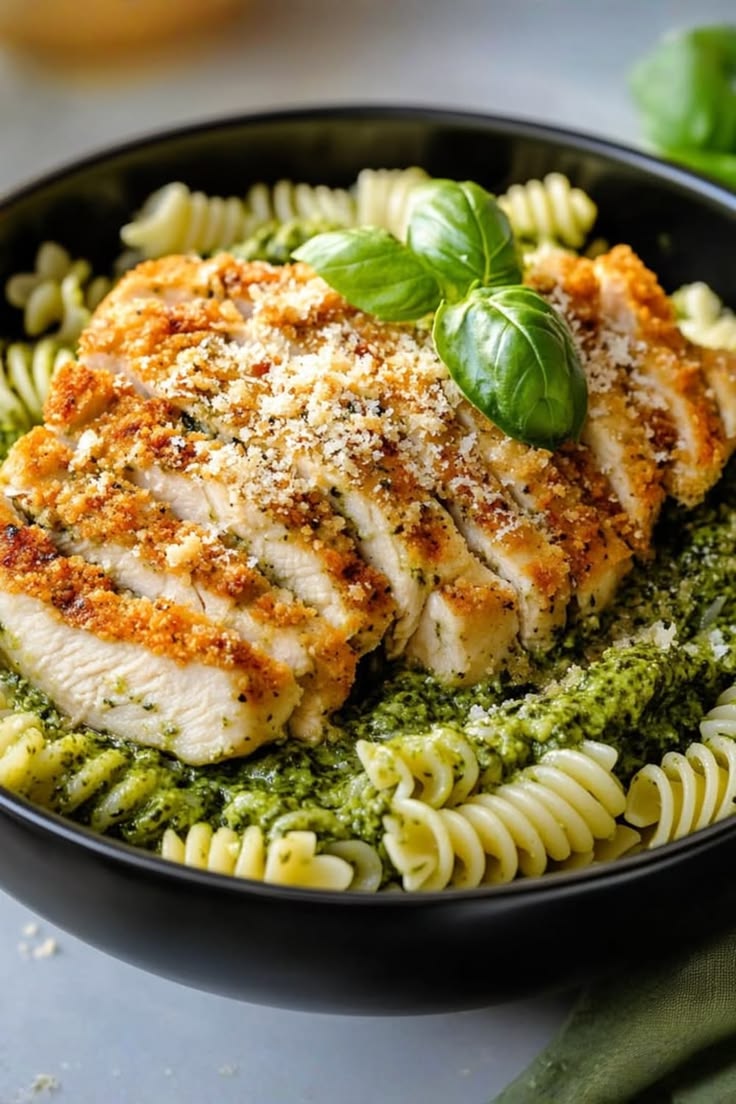 Emmajhones77's tweet photo. Crispy parmesan chicken with pesto pasta https://t.co/LGkF9EiWnw