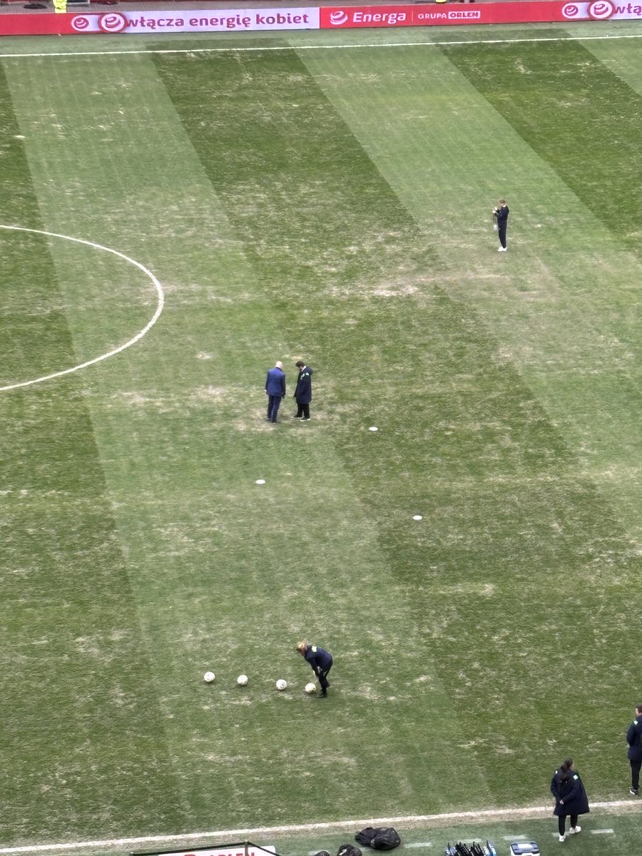 JFallonExaminer's tweet photo. FAI officials examining Gdansk Arena surface 75 mins before Poland v Ireland kicks off. For such a superb stadium, it’s in terrible condition. https://t.co/JwasbSWbYP