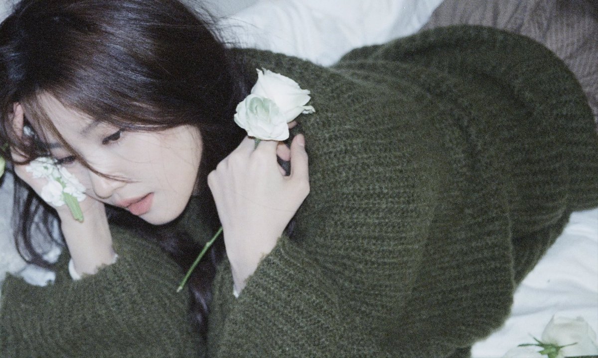 Even in the presence of life's delicate bloom, she finds herself holding onto the shards of a broken dream. 🥀