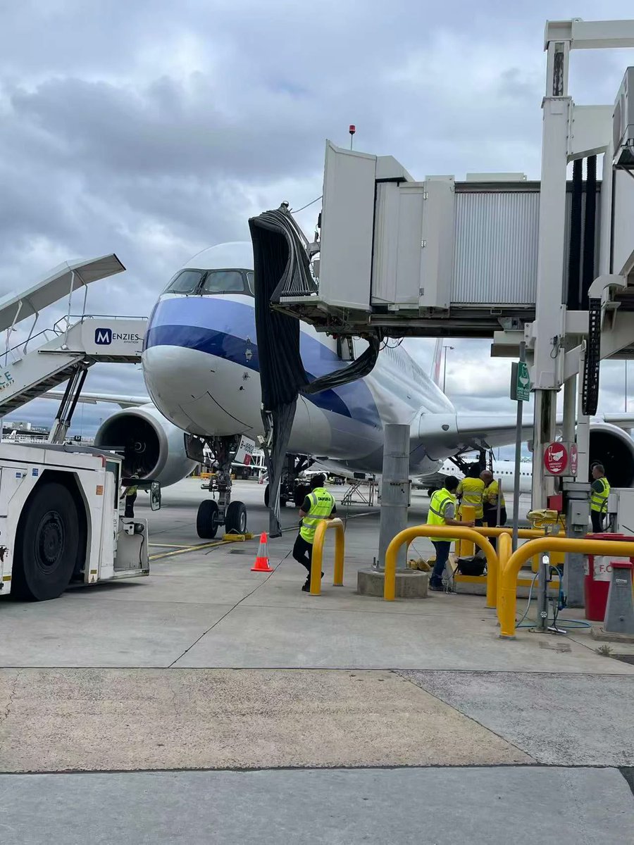 fl360aero's tweet image. According to some sources, the Airbus A350-941 aircraft was in the process of towing to a gate post disembarkation (flight CI58) by the ground maintenance personnel.

The tow truck was connected with aerobridge still on, aircraft parking brake was set to off.

When ramp service