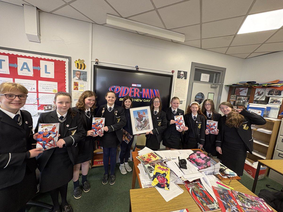 OLSComicClub's tweet photo. 💥 We were delighted to unveil a very special piece of art- a framed picture from @StockmanNate with the message “To the girls of OLS- CHEERS!” 

This picture will go pride of place in the Comic Book section of our Library, beside the great Batman art from @Clay_Mann_ @TomKingTK https://t.co/ouNrTTgev0