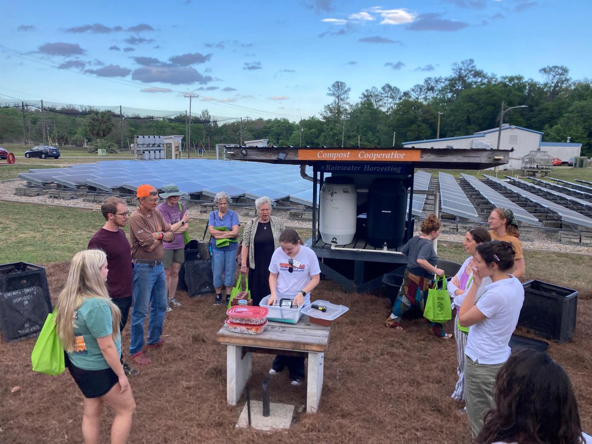 SoilWaterSci's tweet photo. The Compost Cooperative and Gardens was happy to host visitors during the 7th Annual @zerowastegnv event. McKenna Kupcha, @UF undergraduate and compost manager, demonstrates preparing food scraps for composting and turning compost in a bin. https://t.co/iAY5eoadMk
