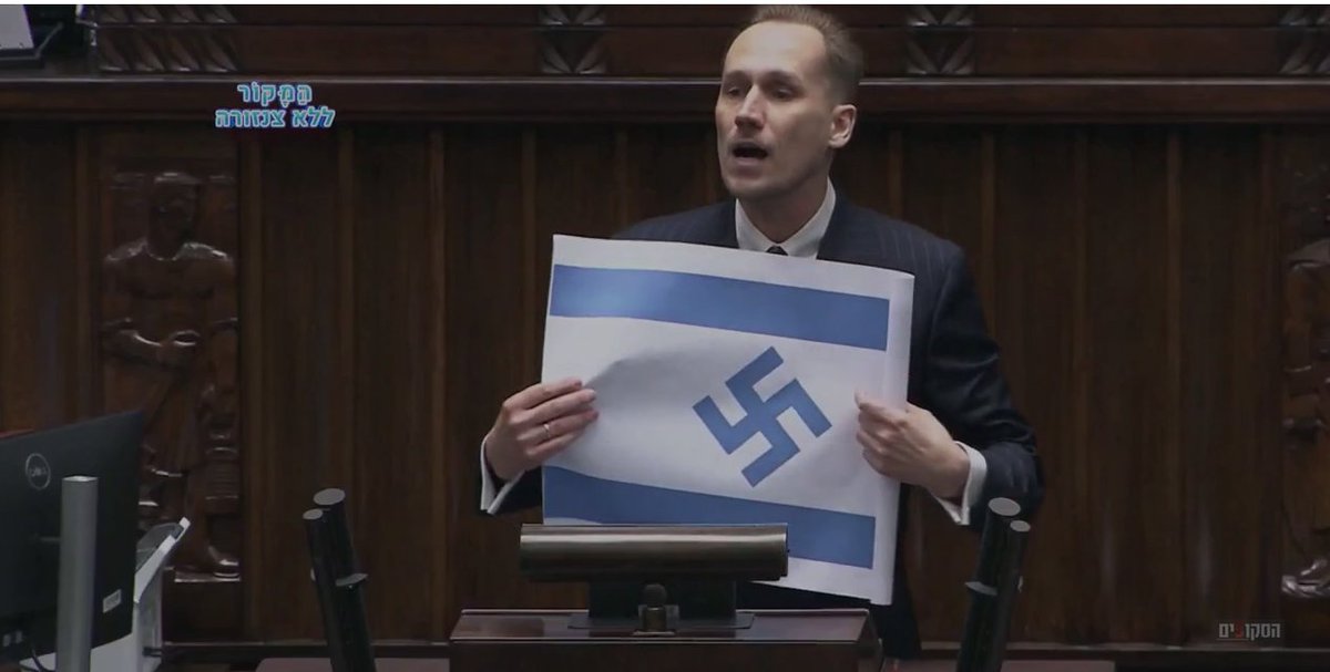 ArieHacker's tweet photo. במהלך יום השואה: חבר הפרלמנט הפולני מטעם מפלגת הימין הקיצוני "קונפדרציה", הציג במהלך נאומו בפרלמנט דגל ישראל כשבמרכזו צלב קרס ואמר, "ישראל מבצעת רצח-עם - היא הרייך השלישי החדש, והדגל שלה צריכה להיראות בדיוק ככה" 

נאצי בן של  שרמוטות !!!!!!!! https://t.co/KpMHP7zoyt