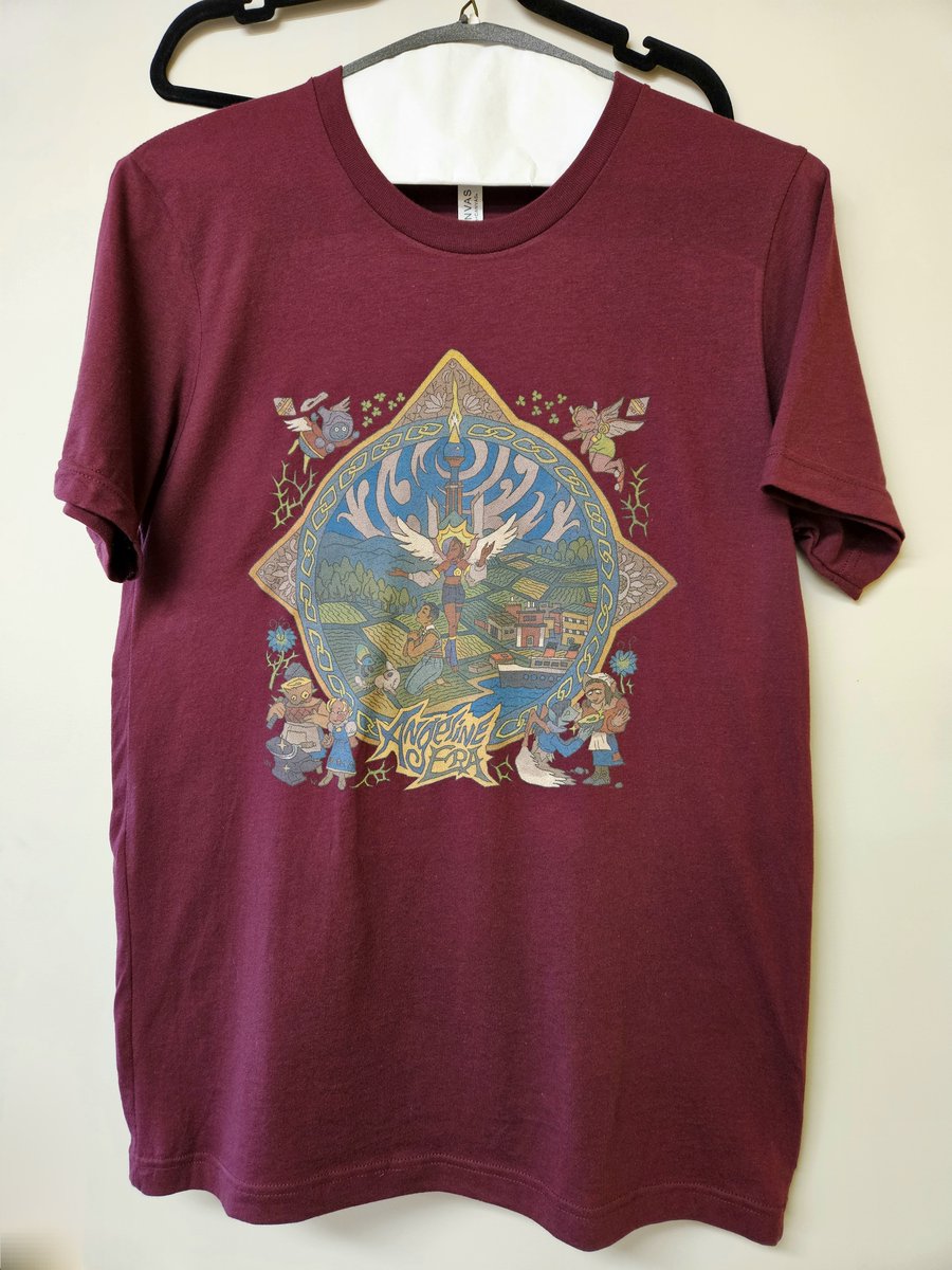 AngelineEraGame's tweet photo. our first ANGELINE ERA MERCH IS HERE!!! A t-shirt of marina's album art, in "screen-fading-after-death" Red. 
link is..below! https://t.co/qLtZYbCm5Y