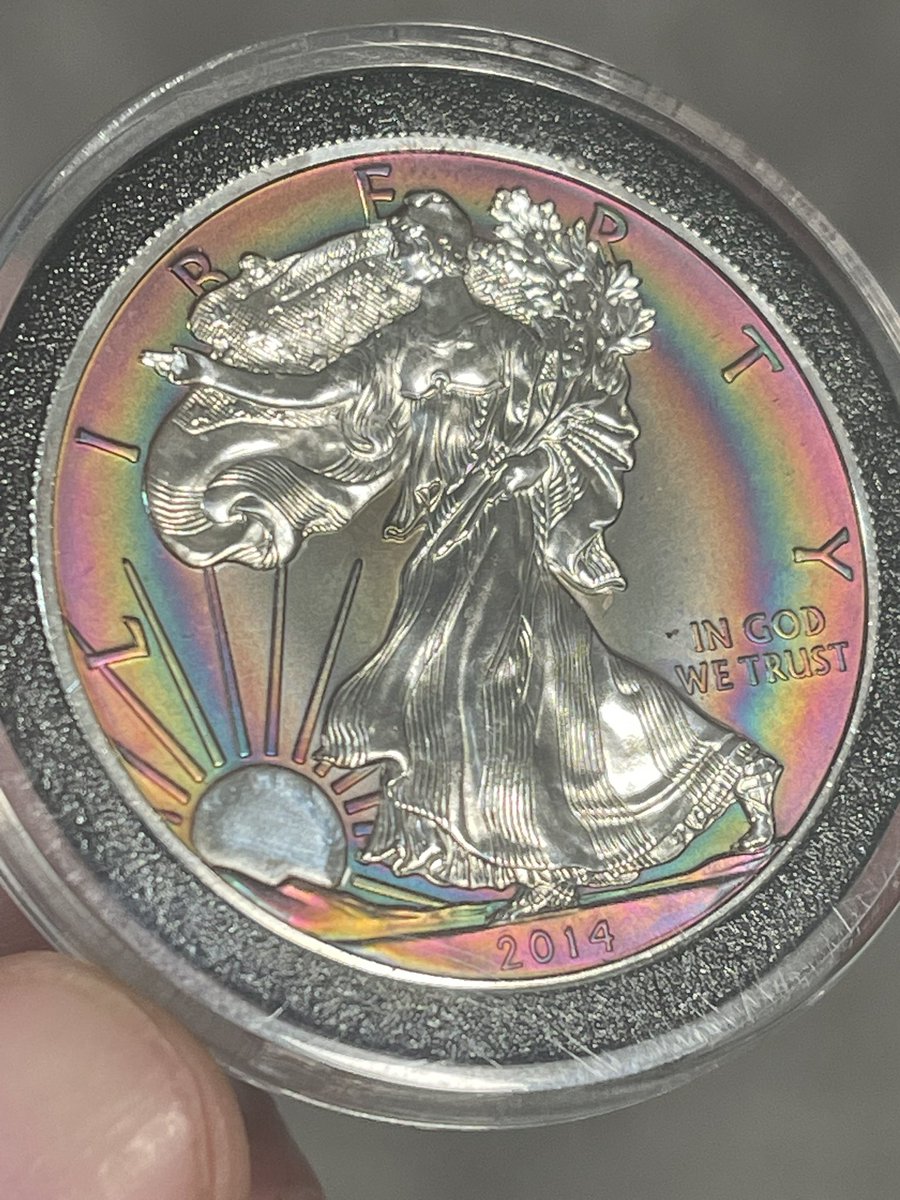 TonedEagles's tweet photo. There is a difference between artificially toned and artfully toned.  

Artificially toned coins are often passed off as “legitimate” toners which is frustrating.

While this 2014 technically is an artificial toner, I think of it as Artfully Toned.  There is no deception here, only beauty.