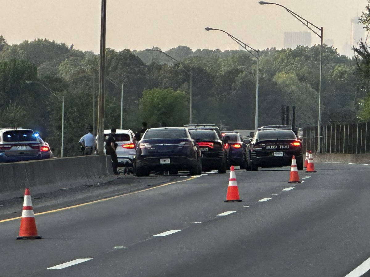 CodyAlcorn's tweet image. .@Atlanta_Police and @ga_dps on I-75 where a woman was found shot. She’s at Grady and at last check was critical. This is right next to the Coca-Cola plant just past  Porsche Avenue. A white SUV is in the scene with a turn signal on.
