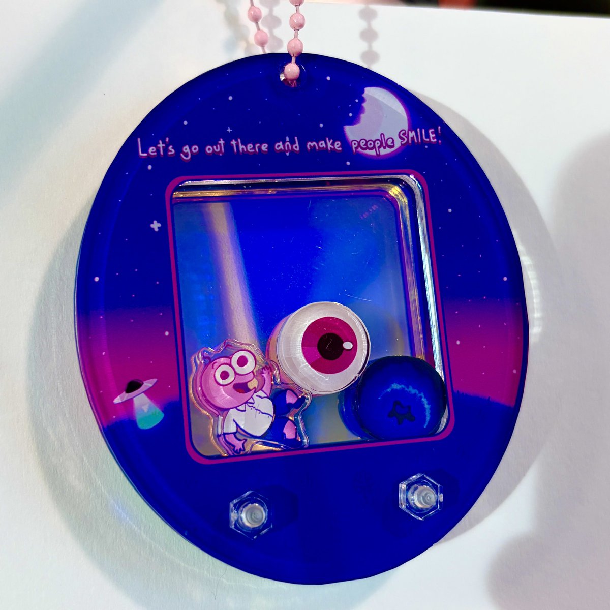 fiaphobe's tweet image. smiling friends tamagotchi keychains i designed