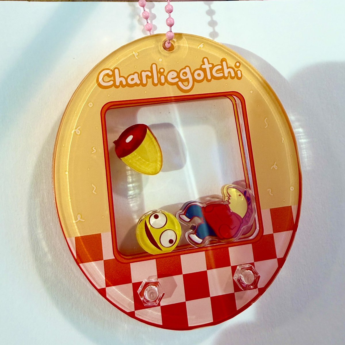 fiaphobe's tweet image. smiling friends tamagotchi keychains i designed