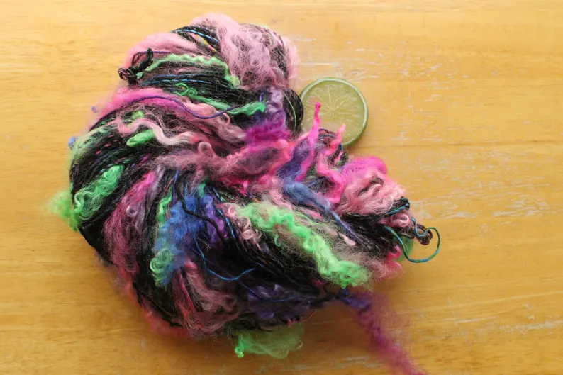 thefinelime's tweet image. Lockspun disco #yarn!  Black #merino with neon #sarisilk and fab, #wool curls. 
etsy.me/4cs4r0Y via @Etsy