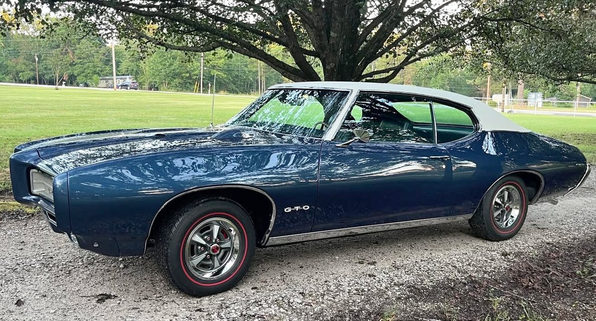 ClassicInd's tweet image. Randy Burrough sent us this photo of his restored 1969 Pontiac GTO with 400ci V8 and 4-speed. He says his parents bought it new and it has always stayed in his hometown of Mountainburg, Arkansas. Beautiful car, Randy! Thanks for sharing it with us. #Pontiac #GTO #restoration