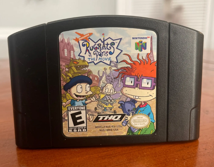 Why the heck is the Nintendo 64 Rugrats in Paris the movie game have a black cartridge?
As a kid I always thought only the darkest, violent, mature games like Turok, WWF No Mercy, Road Rash were allowed to have it.