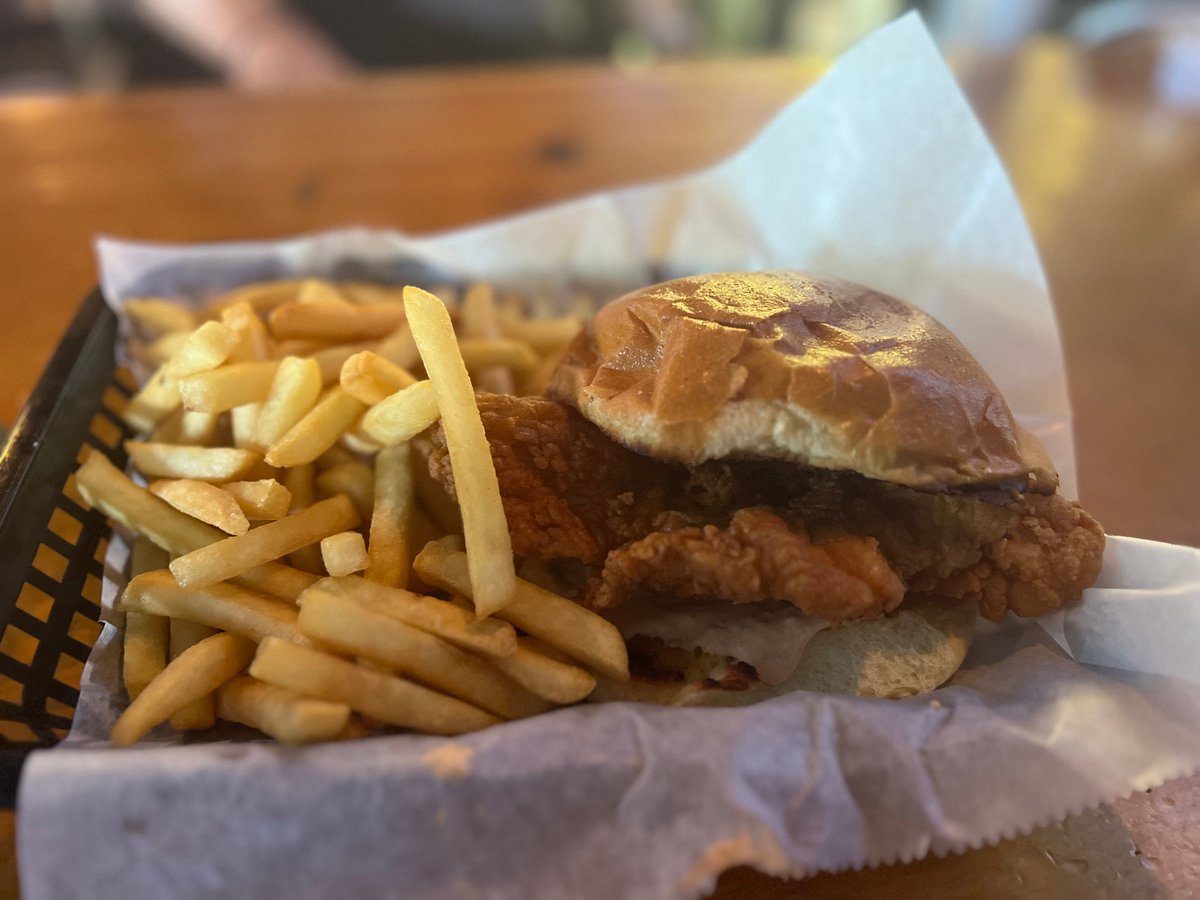 Get ready to meet The Mother Clucker at Scoreboard Bar &amp; Grill! 🐔🍽️ Freshly breaded chicken, tangy pickles and spicy mayo sauce nestled in a soft brioche roll. Comes with a side of crispy chips. Flavor-packed goodness awaits you! #ScoreboardBarGrill #ChickenDelight 😋