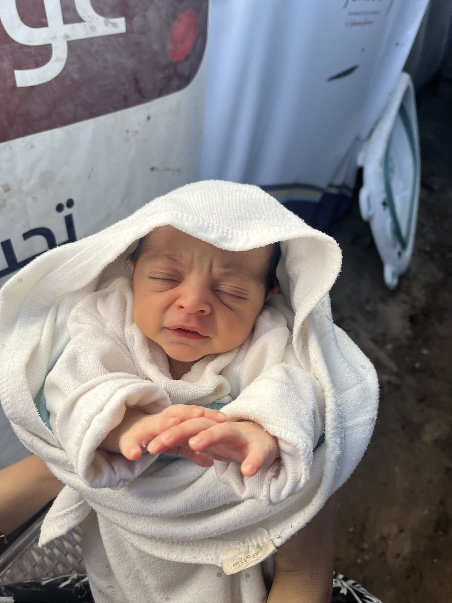 This is our child… born in a tent, in the heart of genocide, suffering, fear, and hunger.
We can't even provide her with milk, or diapers.
I stand helpless before her most basic rights… powerless to protect her or give her the life she deserves.

She doesn't ask for much… just