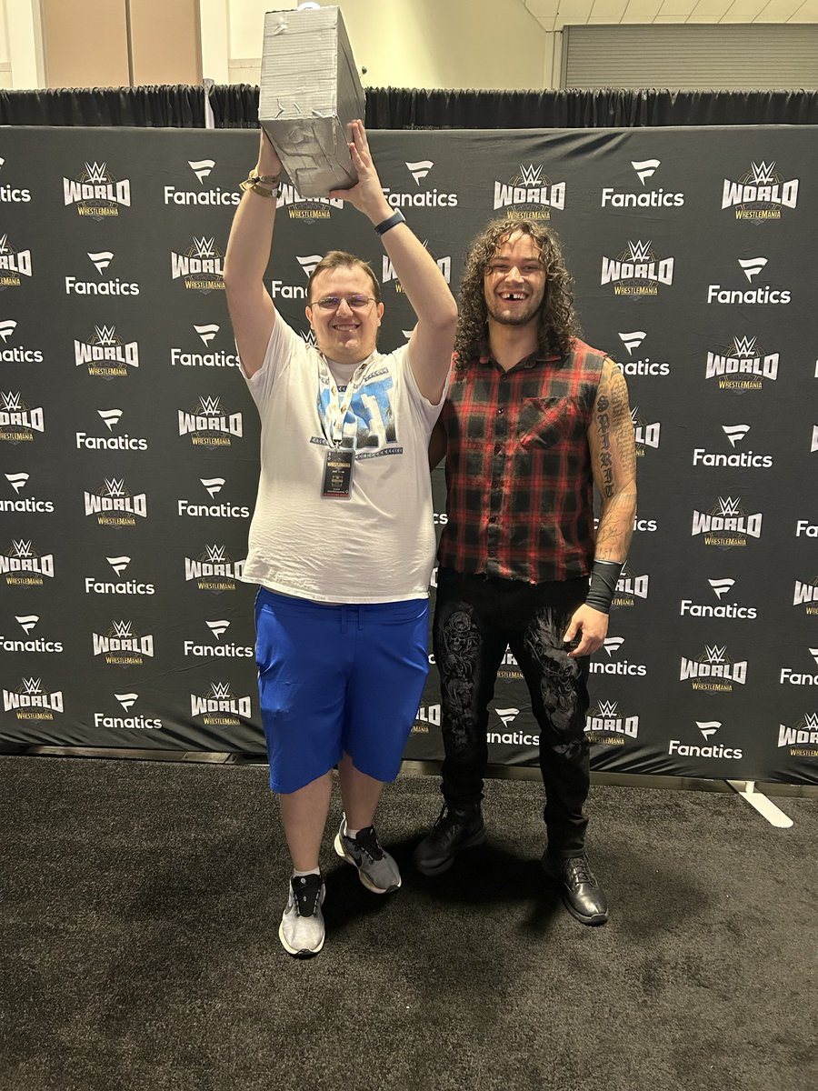 OfficialSpenny_'s tweet photo. @shiloh_wwe Had a ticket but had to refund cause I can’t make Saturday. Was looking forward to it but at least I still have last year’s superstar row photo! https://t.co/T5eXUdXBl2